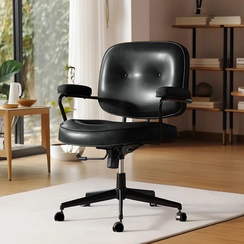 Cresco office chair in black faux leather with button-tufted back, black armrests, and five-wheel base.