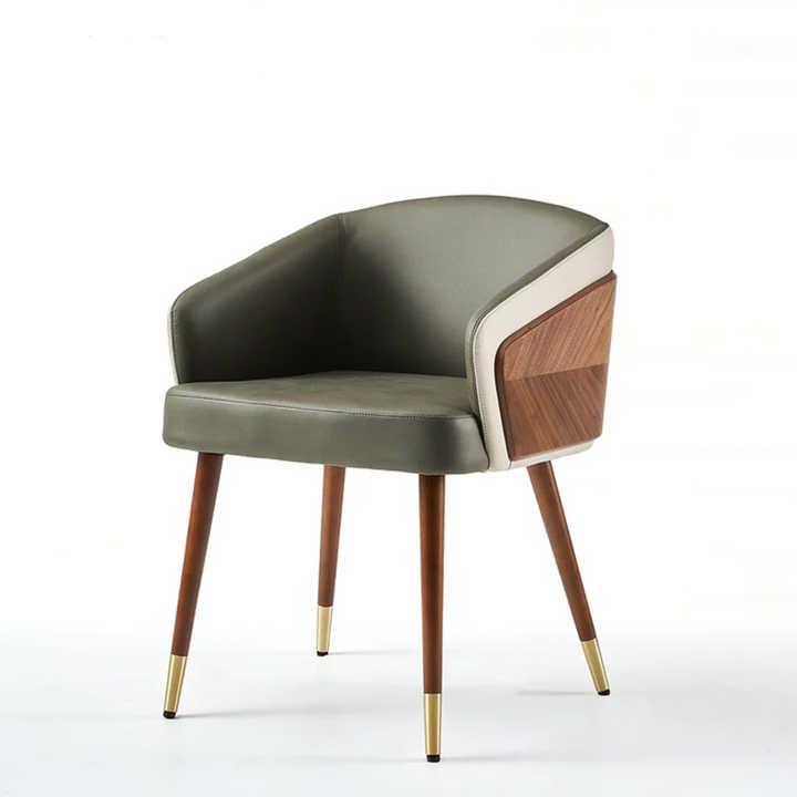 Modenal Dining Chair with olive green leather, white trim, wood paneling, and tapered legs with brass caps.
