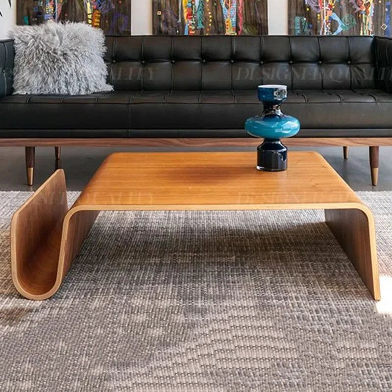 Montecito Coffee Table: Mid-century modern bentwood coffee table with a light brown finish and curved magazine holder.