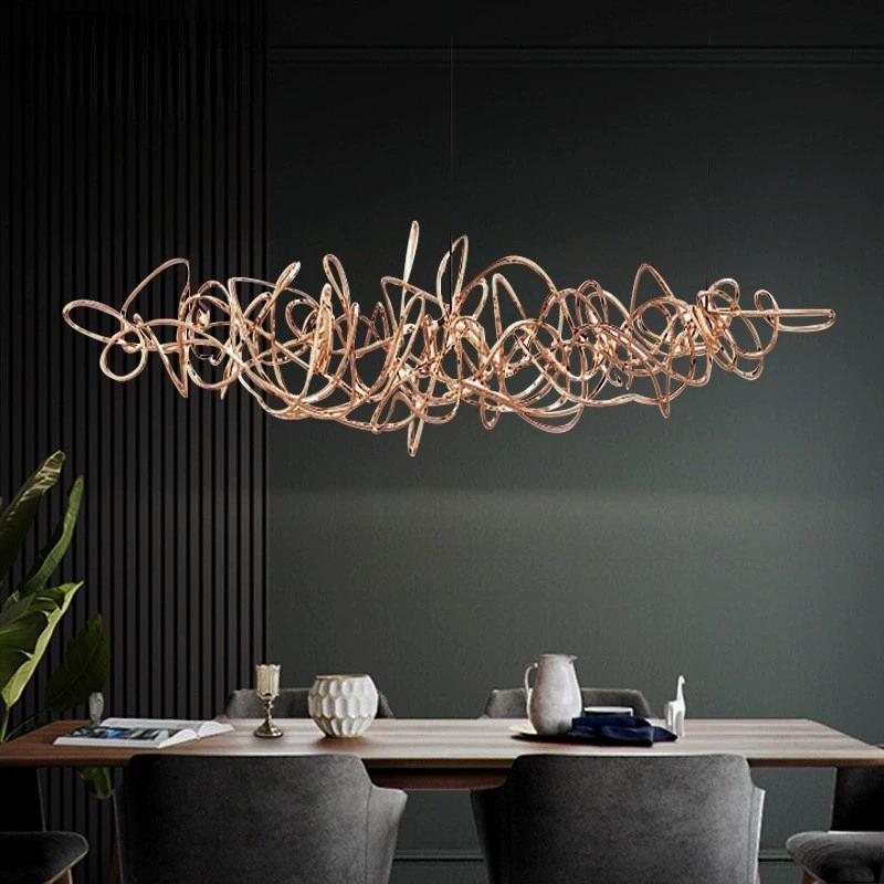Parcaso Chandelier, 80cm rose gold abstract linear chandelier with warm white light over a dining table.