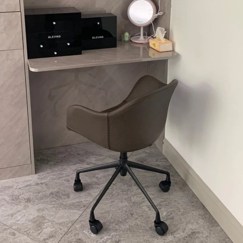 Prescott Office Chair: Brown leatherette desk chair with black metal caster base.