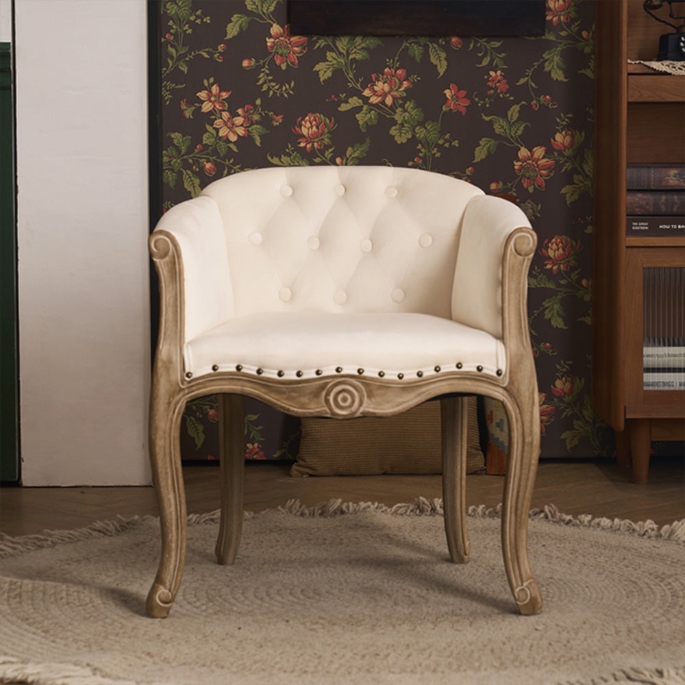 Willem Accent Chair: Cream tufted velvet accent chair with carved light wood frame and nailhead trim.