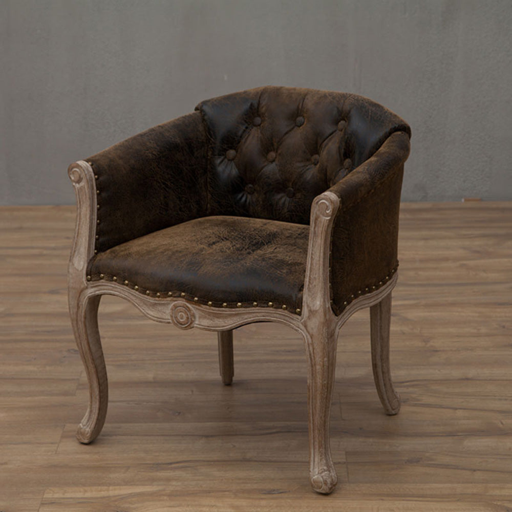 Willem Accent Chair: Distressed brown leather accent chair with button tufting, brass nailheads, and light wood frame.