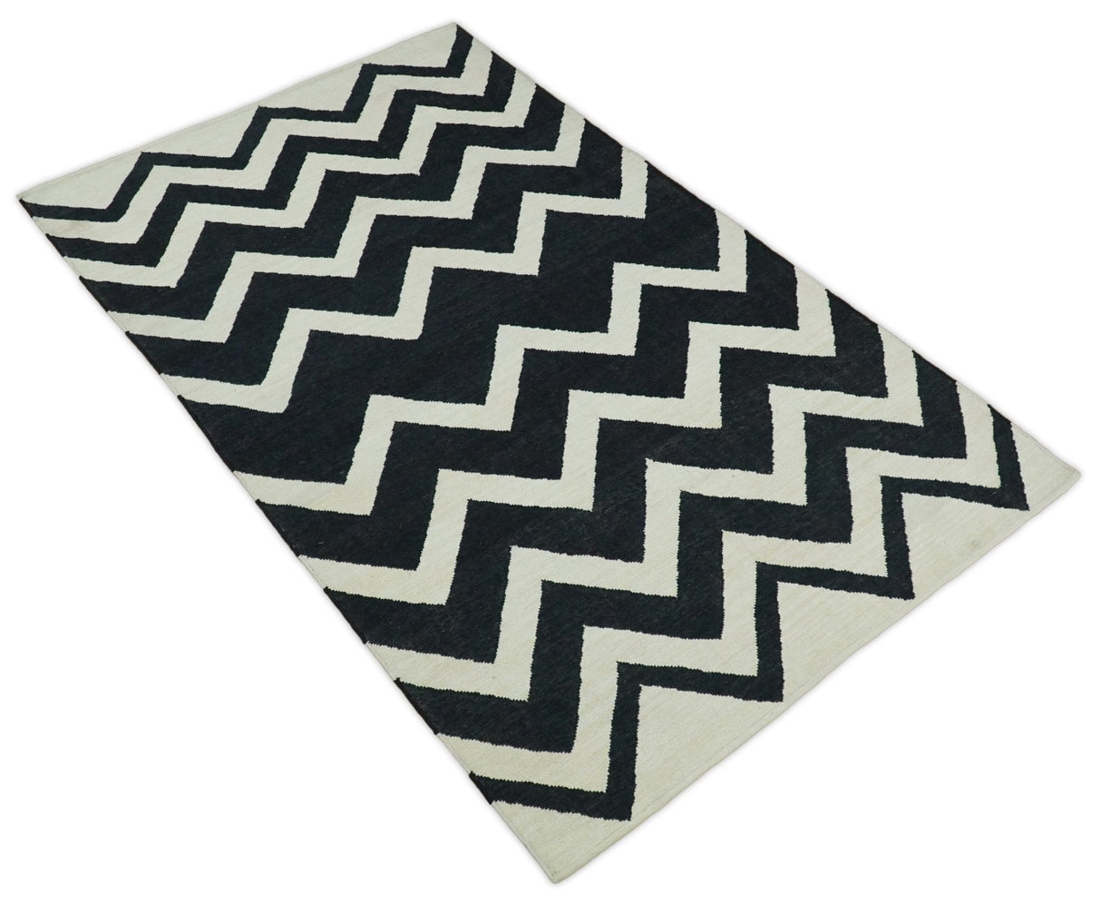 Black and Beige Chevron Design Hand Woven Dhurrie Rug