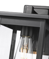 11"H Bowton II Outdoor Wall Light - Dusk to Dawn Matte Black Finish with Glass Shade by Millennium Lighting