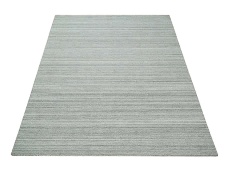 8x10 Hand Made Solid Ivory and Brown Blended Wool Flatwoven Area Rug