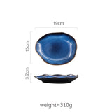 Small Atlas Dinner Plate, 19cm x 15cm, with a deep blue glazed, organic-shaped ceramic design.