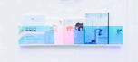 Chameleon Avenue Wall-Mounted Magazine Shelf, 30cm, clear acrylic with blue tint, holding books.