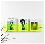 Neon Avenue Wall-Mounted Magazine Shelf, 30cm, holding three magazines.