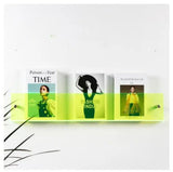 Neon Avenue Wall-Mounted Magazine Shelf, 30cm, holding three magazines.