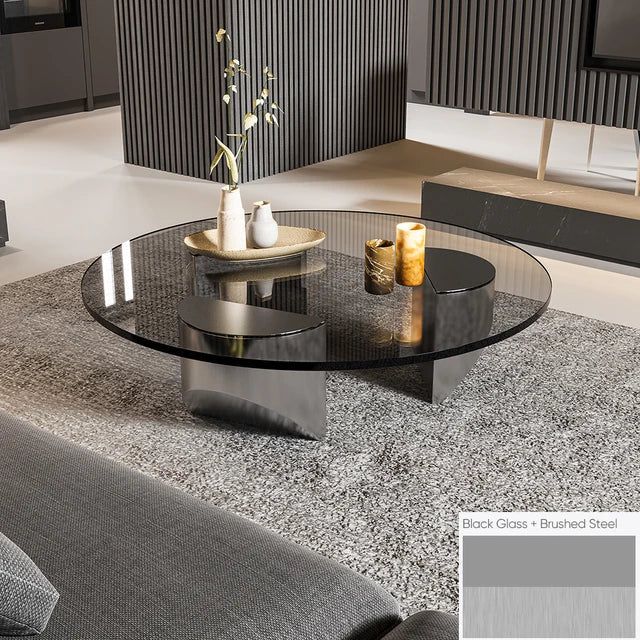 Bassano coffee table with round black glass top and brushed steel base.