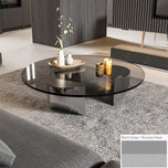 Bassano coffee table with round black glass top and brushed steel base.