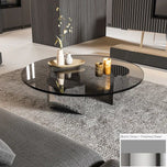 Bassano coffee table with round black glass top and polished steel base.