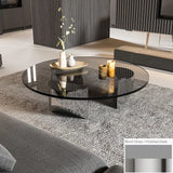 Bassano coffee table with round black glass top and polished steel base.