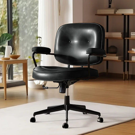 Cresco office chair in black faux leather with button-tufted back, black armrests, and five-wheel base.