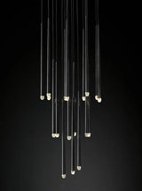 Evora 10-head black pendant chandelier with long, thin tubes and cold white lights.