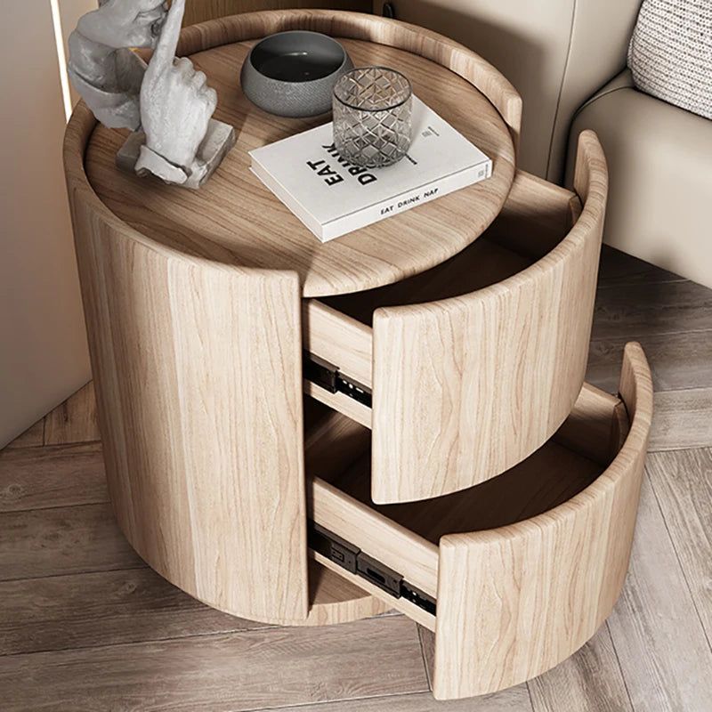 Mira Bedside Table, light wood, round, with two open drawers and a top shelf.