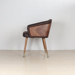 Modenal dining chair in coffee solid wood with chevron back and brass-capped legs.