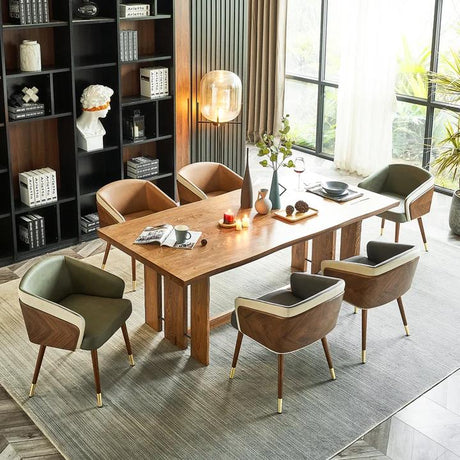 Modenal dining chair in green and brown leather with wood and gold legs, around a wooden dining table.