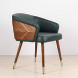 Modenal Dining Chair in olive solid upholstery with walnut wood back and tapered legs with brass caps.