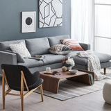 Montecito Coffee Table: Mid-century modern walnut wood coffee table with curved design in a living room.