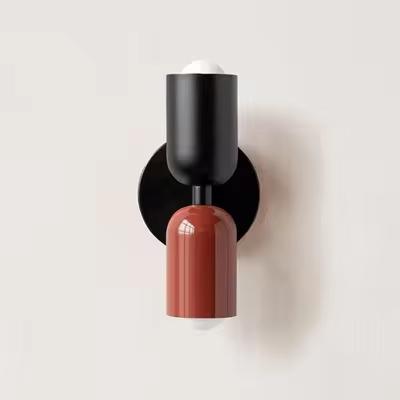 Mura Wall Light, a modern black and terracotta cylindrical wall sconce with two bulbs.