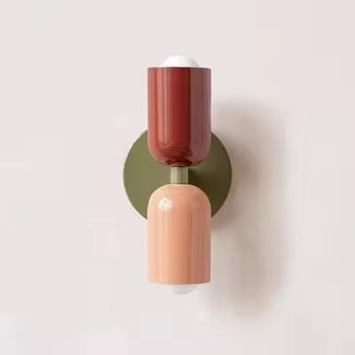 Mura Wall Light, Style 15. Modern wall sconce with stacked terracotta and peach cylindrical shades on an olive green base.