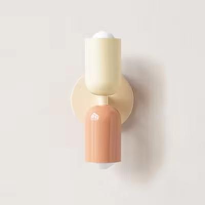 Mura Wall Light, Style 5. Modern two-tone wall sconce with cream and peach cylindrical shades.