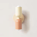 Mura Wall Light, Style 5. Modern two-tone wall sconce with cream and peach cylindrical shades.