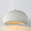 Nara pendant light, 12 inch white textured stone-like dome with warm glow.