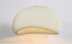 Nara Pendant Light, 12 inch cream organic-shaped fixture with textured surface and soft glow.