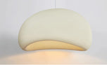 Nara Pendant Light, 12 inch cream organic-shaped fixture with textured surface and soft glow.