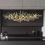 Parcaso Chandelier, 80cm gold abstract linear chandelier with warm white light over a black kitchen island.