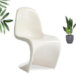 Sora Dining Chair in white, featuring a single-piece, curved, S-shaped modern design.