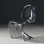 Sora Dining Chair in gray tint. Modern, clear acrylic dining chair with a curved, flowing design.