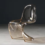 Sora Dining Chair in rust tint, a clear acrylic chair with a curved, modern design.