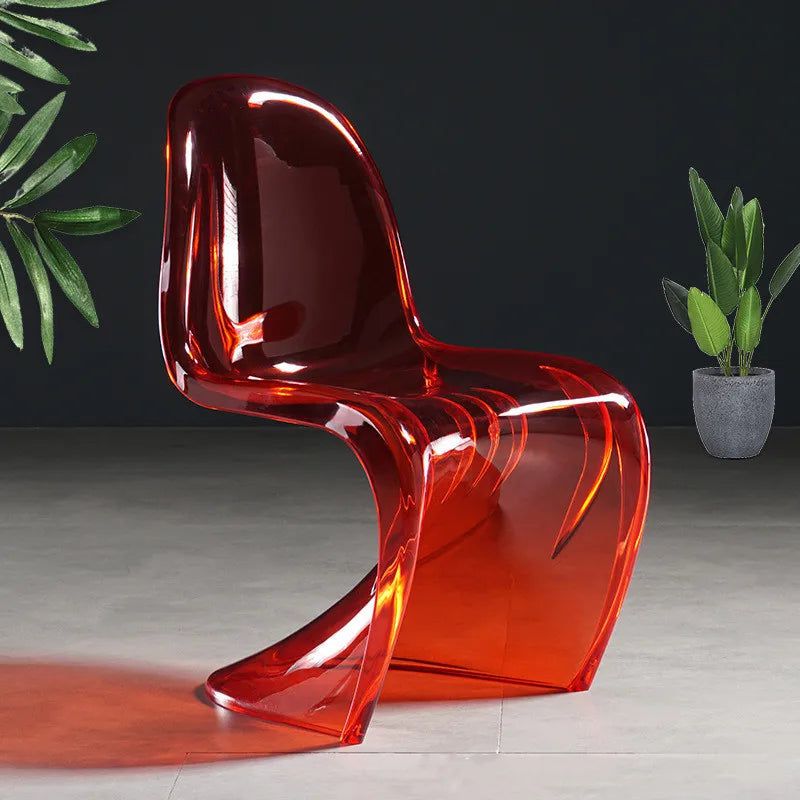 Sora Dining Chair, transparent red acrylic with a curved, modern design.