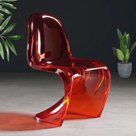 Sora Dining Chair, transparent red acrylic with a curved, modern design.