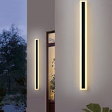 Spire Outdoor Wall Light, 30cm black dimmable LED wall sconce, modern linear design on a white wall.