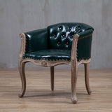 Willem Accent Chair: Dark green tufted leather accent chair with light wood frame and brass nailhead trim.