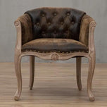Willem Accent Chair in vintage brown leather with tufted back, nailhead trim, and light wood frame.