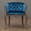 Willem Accent Chair in royal blue velvet with tufted back and carved light wood frame.