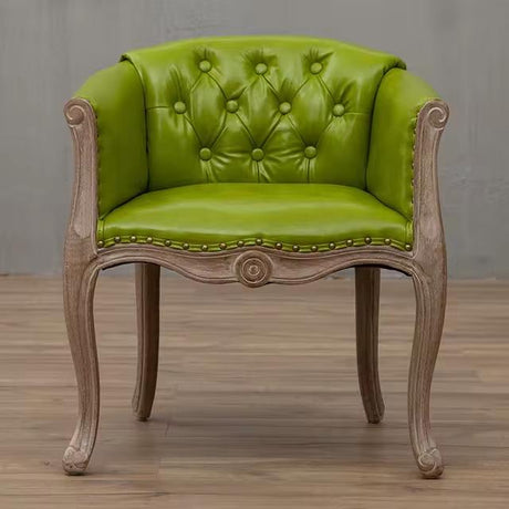 Willem Accent Chair in green apple leather with tufted back, nailhead trim, and carved light wood frame.