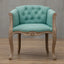 Willem Accent Chair in turquoise linen with tufted back and carved light wood frame.