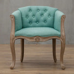 Willem Accent Chair in turquoise linen with tufted back and carved light wood frame.