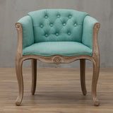 Willem Accent Chair in turquoise linen with tufted back and carved light wood frame.