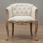 Willem Accent Chair in white linen with tufted back, nailhead trim, and carved natural wood frame.