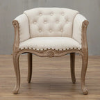 Willem Accent Chair in white linen with tufted back, nailhead trim, and carved natural wood frame.