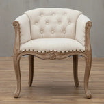 Willem Accent Chair in white linen with tufted back, nailhead trim, and carved natural wood frame.