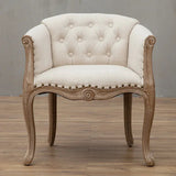 Willem Accent Chair in white linen with tufted back, nailhead trim, and carved natural wood frame.